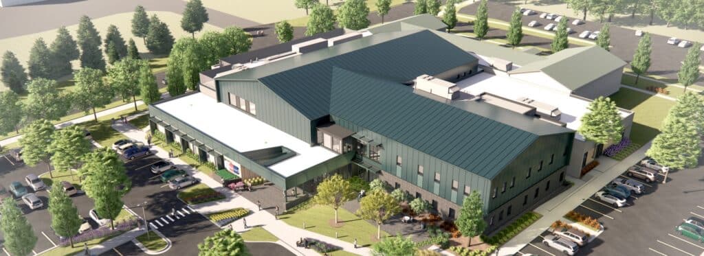 A rendering of what the aerial view of the Greenville GRYMCA will look like. It features trees, signage, and a parking lot.