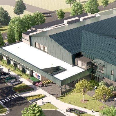 A rendering of what the aerial view of the Greenville GRYMCA will look like. It features trees, signage, and a parking lot.